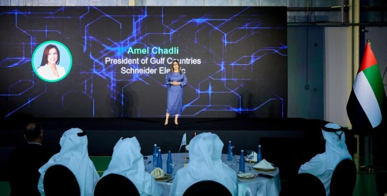 Amel Chadli, President of Gulf Countries for Schneider Electric, speaks on stage at an event