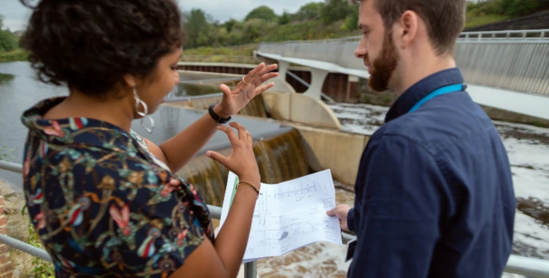 Two_individuals_discussing_water_management_strategy