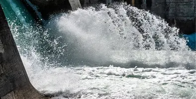 A close up of water cascading out of a hydropower plant.