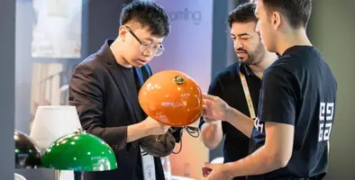 Attendees looking at technology