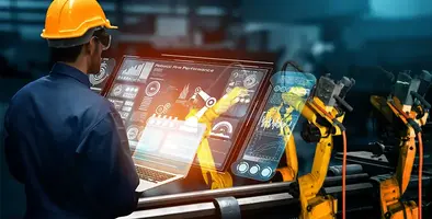 engineer_operating_manufacturing-robot_on_screen