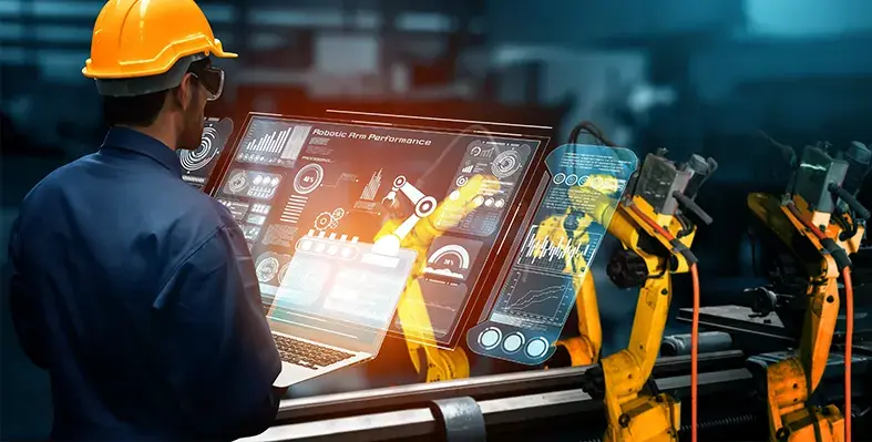 engineer_operating_manufacturing-robot_on_screen