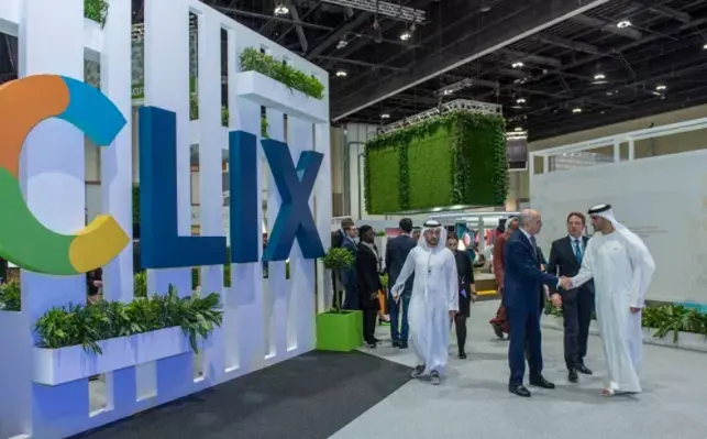 Attendees at a previous WFES around a CLIX banner. 